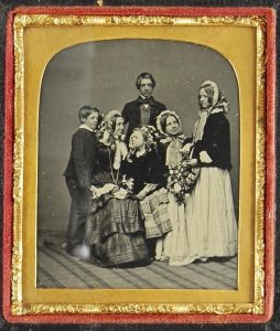 Ambrotype of a seated mother surrounded by her children.