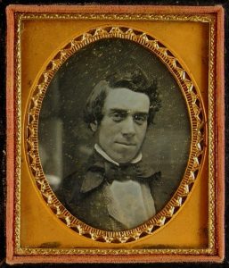 Daguerreotype of a smiling man wearing a flamboyant cravat, c.1855.