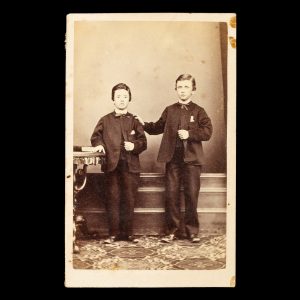 Studio portrait of two identically dressed young brothers. Ballarat, Victoria, late 1860s.