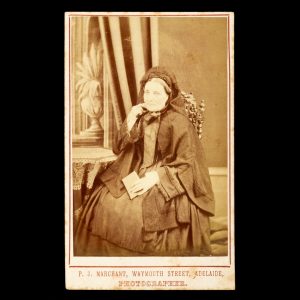 Studio portrait of a lady in mourning dress holding a letter. Adelaide, c.1875.
