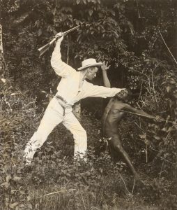 Tableau of a white settler attacking an Aboriginal man. Grafton, New South Wales, 1890s.