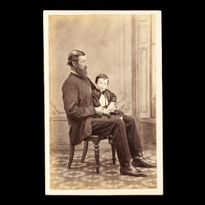 Studio portrait of Mr. D. Ross and his young son. Ipswich, Queensland, circa 1874.