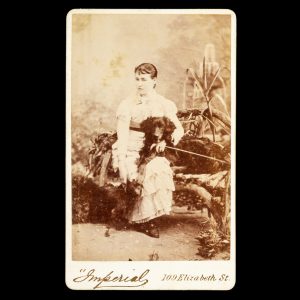 Studio portrait of a woman with her dogs. Melbourne, mid 1880s.