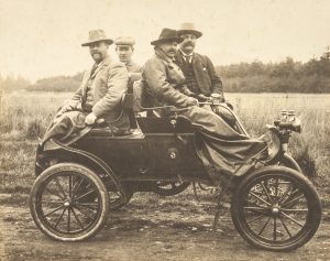 Four Waimate councillors posing in their Oldsmobile after completing the first journey by motor car over Burkes Pass, 1904.