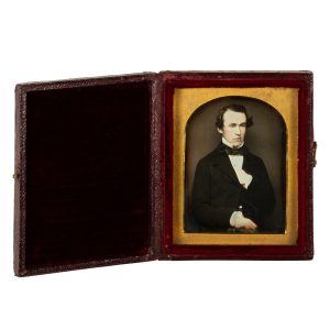 Daguerreotype portrait of a handsome young man with his hand hidden in his suit coat, c.1850.