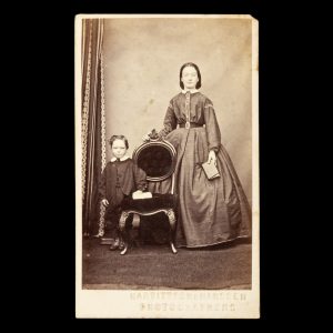 Portrait of a mother and her young son, both posed with a book. Kapunda, South Australia, 1866-67.