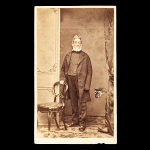 Studio portrait of an elderly gentleman in an ill-fitting frock coat. Hobart Town, 1866-67.