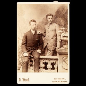 Studio portrait of a two young male friends in an affectionate pose. South Melbourne, late 1880s.